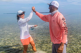 Columbia_EventThumbnail_260x170 Two people high-fiving and laughing while standing in shallow water
