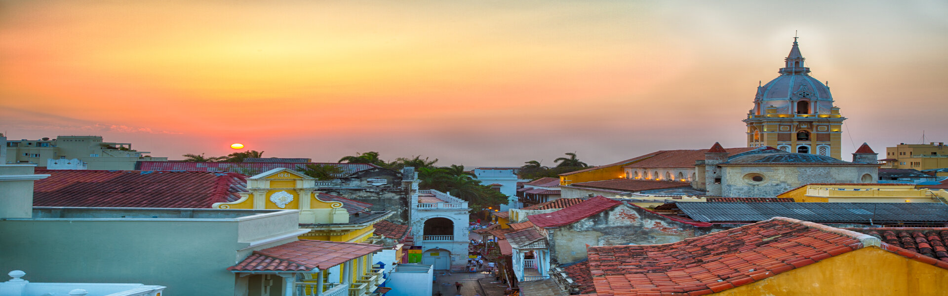 Dusty orange sunset behind buildings