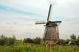 Windmill spins in field