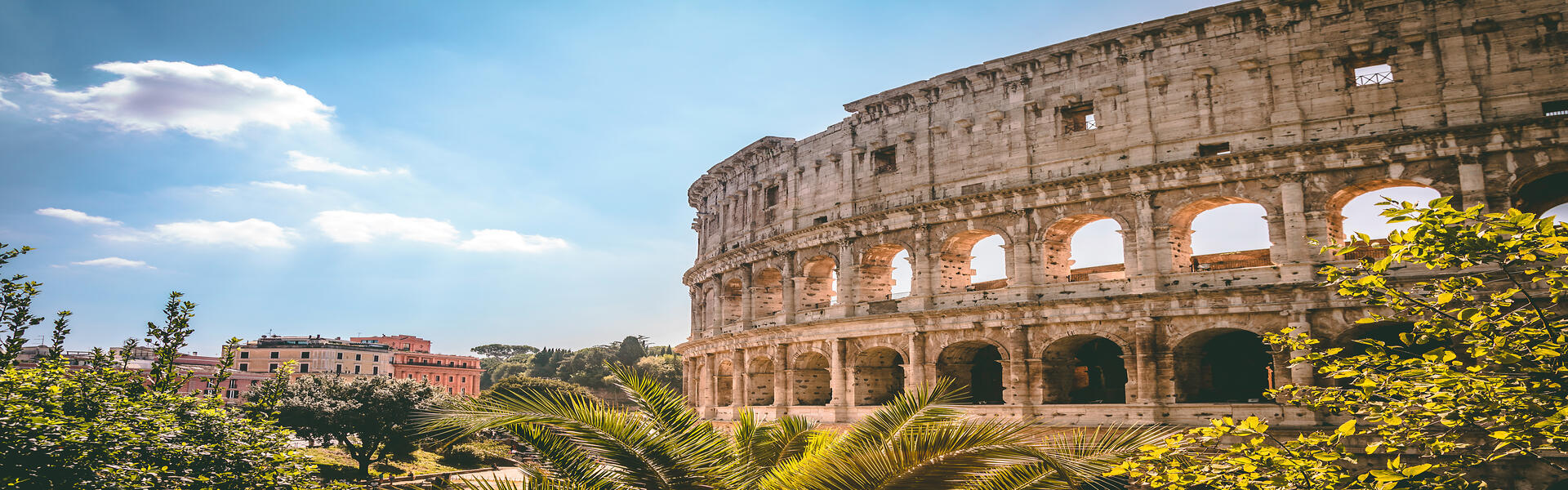 The Colosseum overlooking green brush