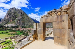 Crumbling ancient city ruins overlook pavilion