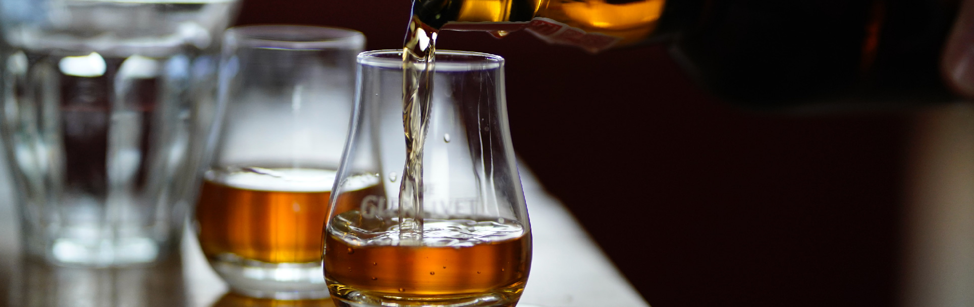 Bourbon being poured into a glass
