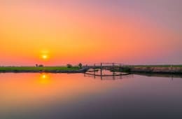 Sunset view of the Mekong River with bridge