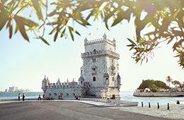 Belem Tower in Portual on coast with tourists
