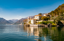 Lanscape of italian lake with lakeside home on the mountains