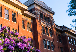 OSU Campus Agricultural Building with purple flowers