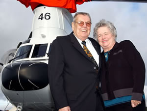 Wes and Nancy Lematta in front of a helicopter