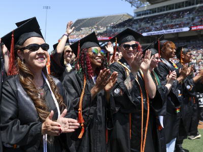 Graduation students clapping.