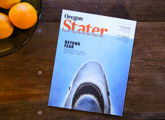 Oregon Stater Winter 2024 magazine cover with an illustration of a shark as an homage to Jaws.