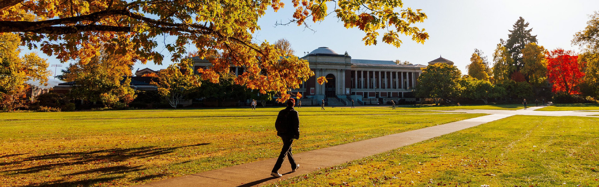 Person walking towards the MU on a Fall day.