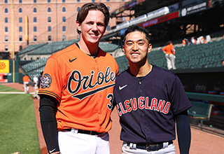 Oregon State's Steven Kwan, left and Adley Rutschman sit on top of