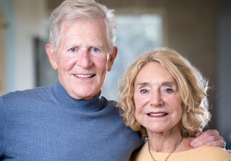 Portrait photo of Mike and Judy Gaulke facing the camera and smiling.