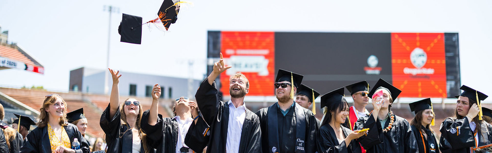 Students celebrate in caps and gowns