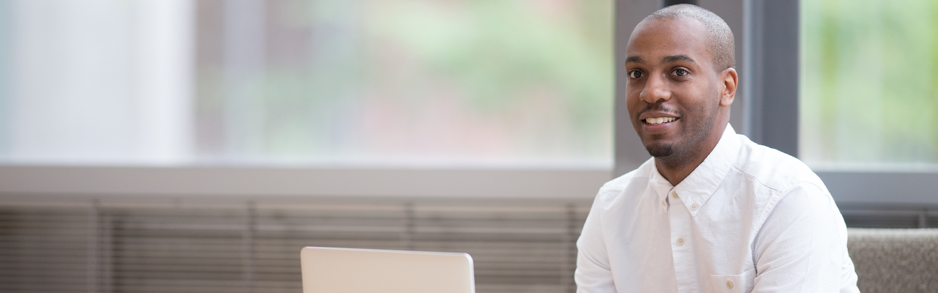 An Ecampus student using a laptop.