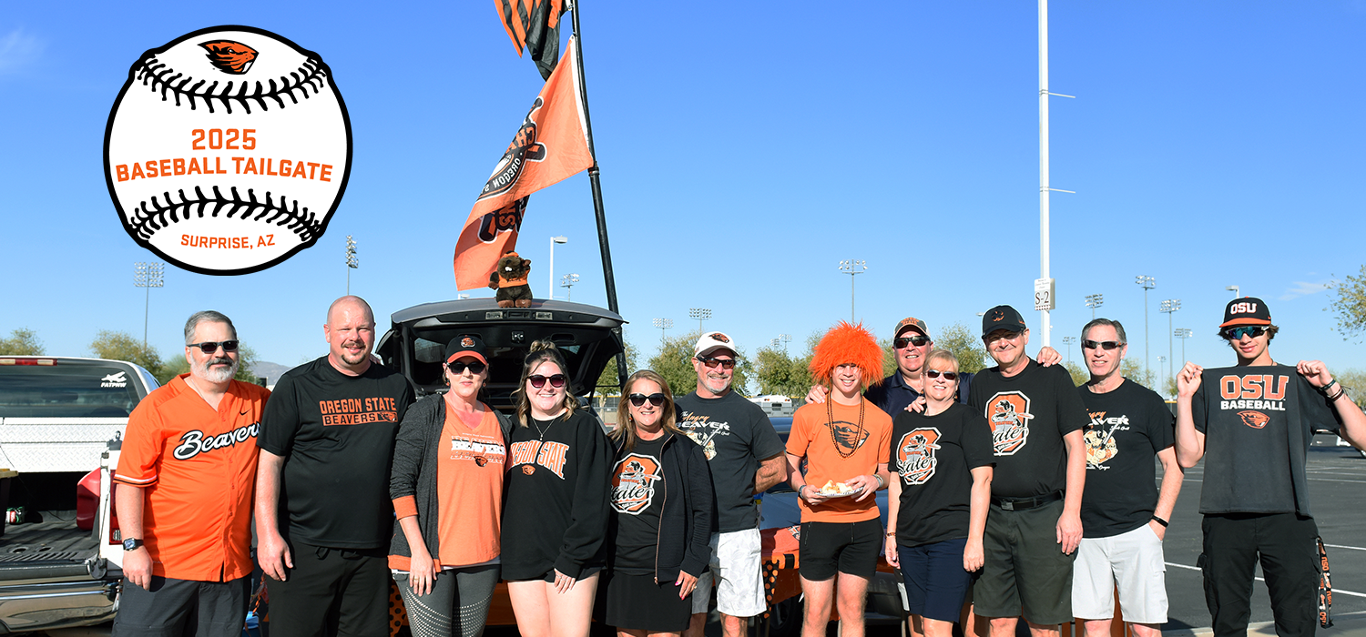 Group of people in Oregon State Beavers apparel standing near an open car trunk at a tailgate event.