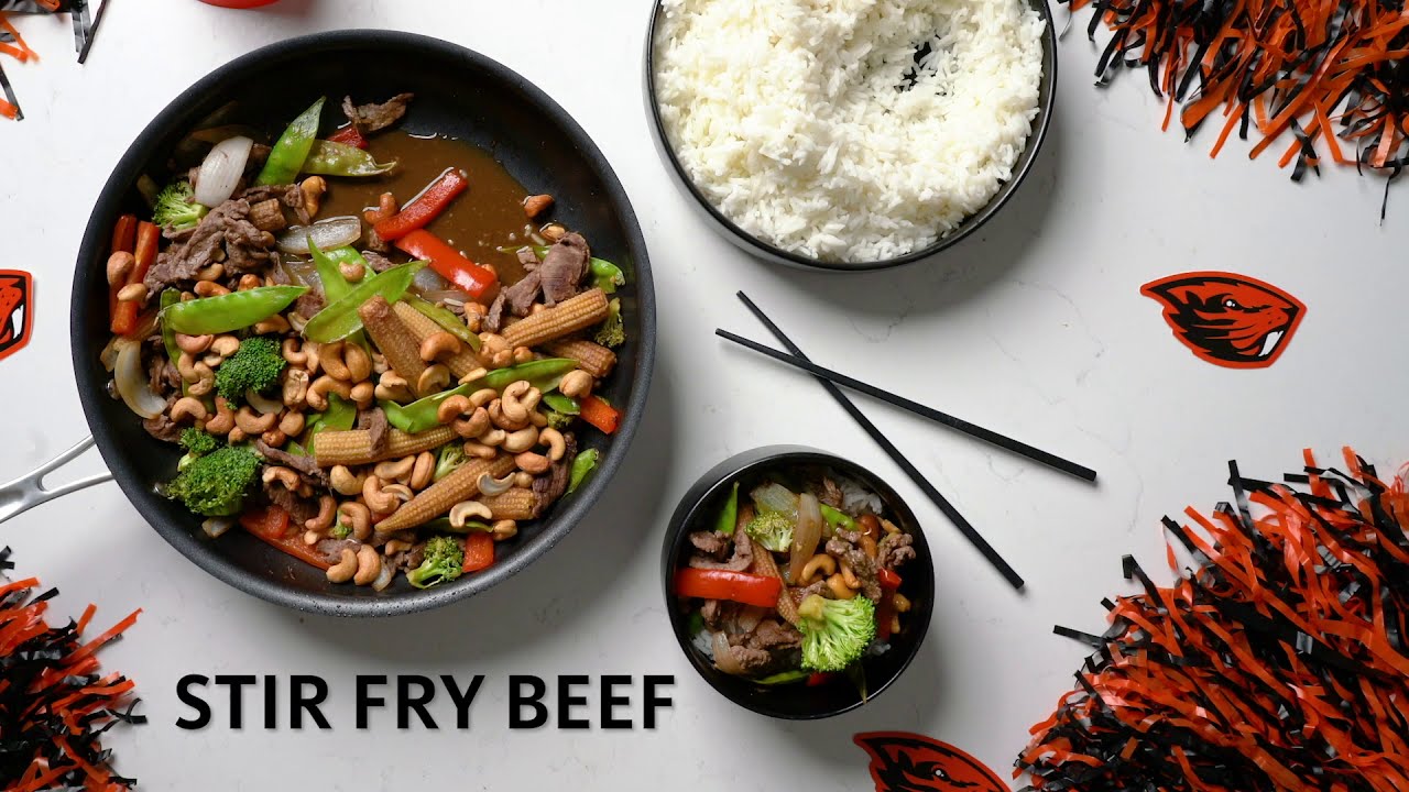 Stir Fry in a pan with chopsticks and rice