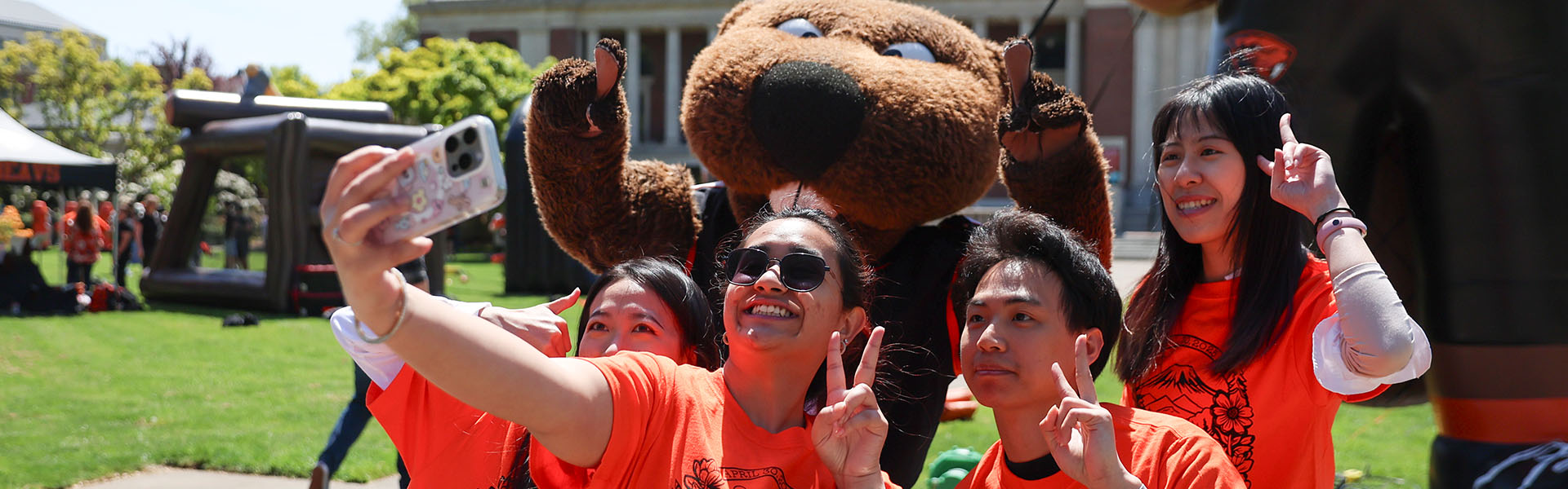 DPD_0000_043025 Dam Good Day 166_Banner Photo of students and Benny the Beaver mascot on campus during Dam Proud Day 2025