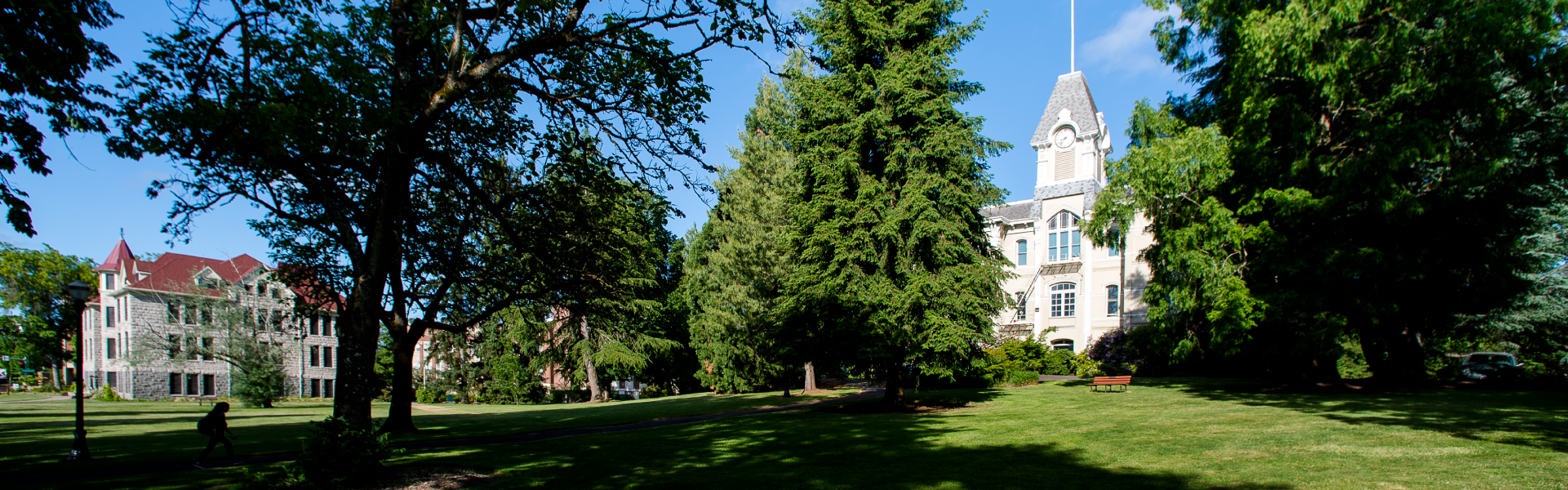 Scenic view of grass and Benton building